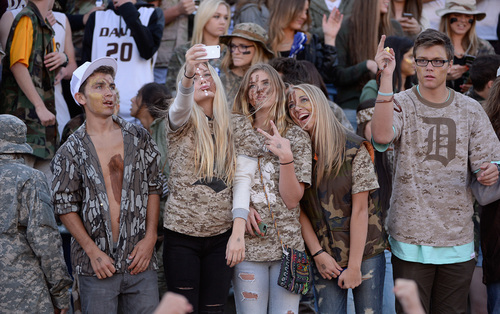 Francisco Kjolseth  |  The Salt Lake Tribune
Davis High fans take selfies and cheer on their team as they get ready to take on Syracuse in game action at Davis in Kaysville on Thursday, Sept. 11, 2014.