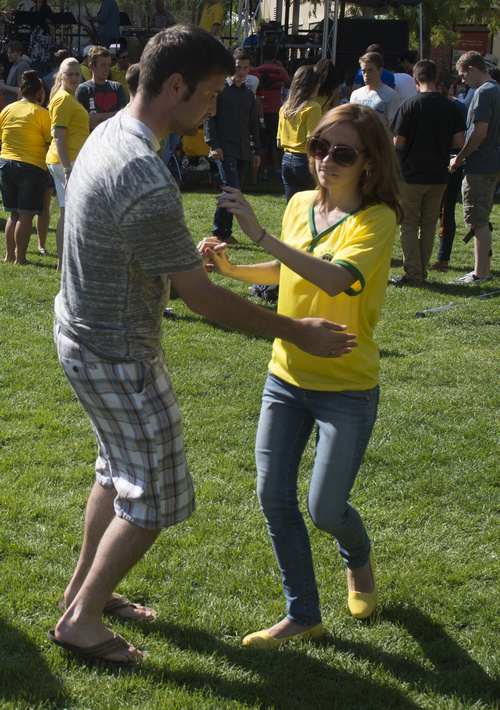 Rick Egan  |  The Salt Lake Tribune

Jordan Collette dances with Jessica Correa, at the 10th Annual Utah Brazilian Festival at the Gateway, Saturday, September 13, 2014.  The festival features the best of Brazilian arts, culture, music and cuisine, along with face painting, capoeira.