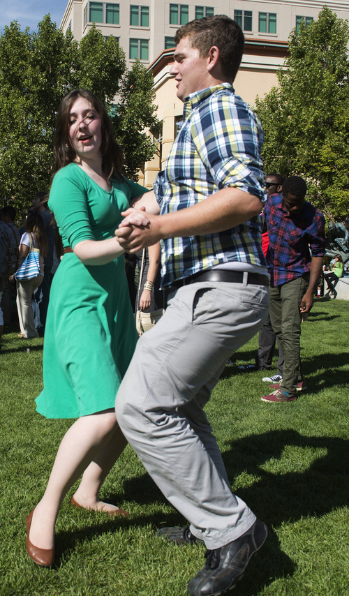 Rick Egan  |  The Salt Lake Tribune

Anthony Smith and Caitlin Willey dance at the 10th Annual Utah Brazilian Festival at the Gateway, Saturday, September 13, 2014.  The festival features the best of Brazilian arts, culture, music and cuisine, along with face painting, capoeira.