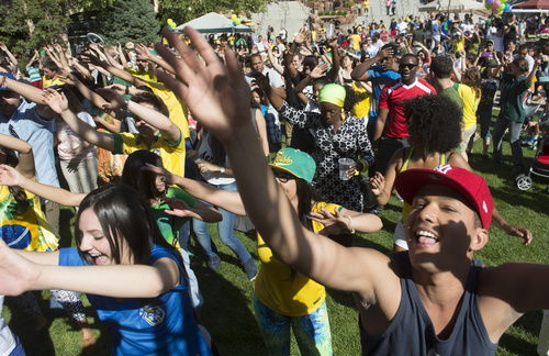 Rick Egan  |  The Salt Lake Tribune

Festival goes, dance to Brazillian music10th Annual Utah Brazilian Festival at the Gateway, Saturday, September 13, 2014.  The festival features the best of Brazilian arts, culture, music and cuisine, along with face painting, capoeira.