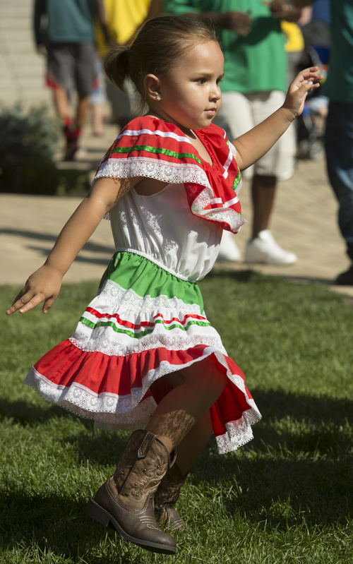 Rick Egan  |  The Salt Lake Tribune

Four-year-old Samantha Banner, Provo, dances to Brazilian music, at the10th Annual Utah Brazilian Festival at the Gateway, Saturday, September 13, 2014.  The festival features the best of Brazilian arts, culture, music and cuisine, along with face painting, capoeira.