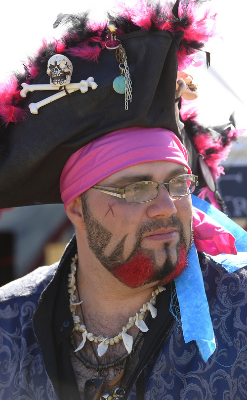 Leah Hogsten  |  The Salt Lake Tribune
Pirate "Mighty Porthos" aka Brian Weller of the "Bretheran of the Black Phoenix" guild from Grand Junction, CO entertains the crowd at the 4th Annual Utah Pirate Festival during the Utah Renaissance Festival and Fantasy Fair site located at 3105 West Pioneer (400 North) Road, Marriott-Slaterville, September 12, 2014.