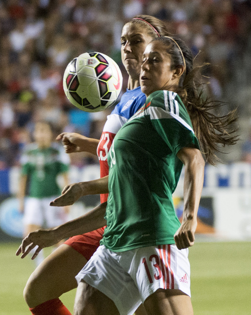 Rick Egan  |  The Salt Lake Tribune

Mexico's Biana Sierra (13), collides with Alex Morgan (13) of the U.S. Women's team, in Soccer action, U.S. Women's National Team, vs. Mexico, Saturday, September 13, 2014