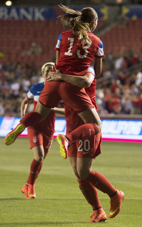 Rick Egan  |  The Salt Lake Tribune

USA's Alex Morgan (13), jumps into the arms of Abby Wambach (20) after Wambach scored for the U.S. Women's team, in Soccer action, U.S. Women's National Team, vs. Mexico, Saturday, September 13, 2014