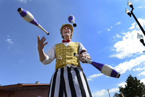 Scott Sommerdorf   |  The Salt Lake Tribune
"Leapin' Louie" juggles on stilts during the final day of the Utah State Fair, Sunday, September 14, 2014.