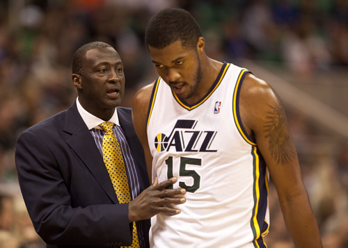 Lennie Mahler  |  The Salt Lake Tribune
Jazz coach Tyrone Corbin speaks with Derrick Favors as the Jazz face the Portland Trailblazers at EnergySolutions Arena on Wednesday, Oct. 16, 2013.