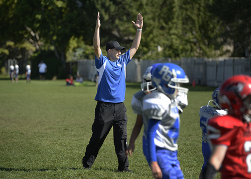 Scott Sommerdorf   |  The Salt Lake Tribune
Brandon Doman, former BYU offensive coordinator, celebrates a Viking's TD as he coaches a fourth-grade football team - The  Pleasant Grove Vikings, in their game versus American Fork, Saturday, September 13, 2014.