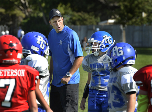 Scott Sommerdorf   |  The Salt Lake Tribune
Brandon Doman, former BYU offensive coordinator, gives his team instructions as he coaches a fourth-grade football team - The  Pleasant Grove Vikings, in their game versus American Fork, Saturday, September 13, 2014.