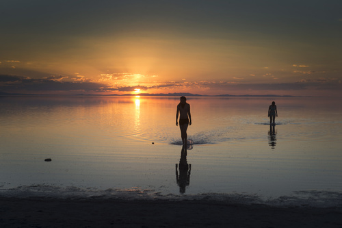 Rick Egan  |  The Salt Lake Tribune

Bas Tim, and Jes Downey, Greenville, NC, walk to the shore after floating in the Great Salt Lake on Antelope Island, Monday, September 15, 2014