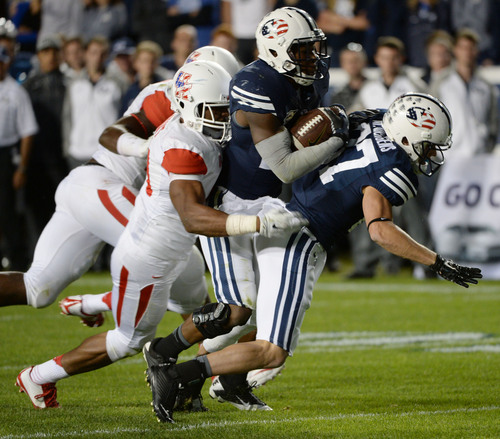 Steve Griffin  |  The Salt Lake Tribune


BYU Cougars running back Jamaal Williams (21) runs into teammate BYU Cougars wide receiver Mitchell Juergens (87) as the Houston defense drags him down in the second half of the  game between BYU and Houston and LaVell Edwards Stadium in Provo, Thursday, September 11, 2014.