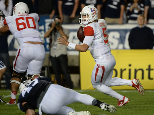 Steve Griffin  |  The Salt Lake Tribune


Houston Cougars quarterback John O'Korn (5) scrambles out of the pocket in the second half of game between BYU and Houston and LaVell Edwards Stadium in Provo, Thursday, September 11, 2014.