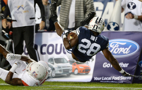 Steve Griffin  |  The Salt Lake Tribune


BYU Cougars running back Adam Hine (28) gets flipped into the air as he runs the ball in the second half of the  game between BYU and Houston and LaVell Edwards Stadium in Provo, Thursday, September 11, 2014.