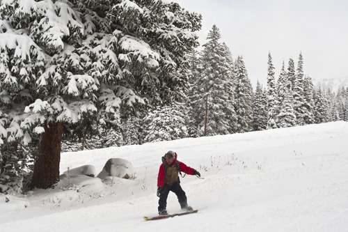 Chris Detrick  |  Tribune file photo
A snowboarder rides at Brighton in 2012. Salt Lake City is now marketing itself as Ski City USA because of its proximity to Solitude, Brighton, Snowbird and Alta.