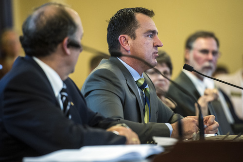 Chris Detrick  |  Tribune file photo
UTA Board Chairman Greg Hughes, right, and General Manager Mike Allegra speak during an Audit Subcommitteemeeting of the Legislature last month. Hughes is stepping down as chairman but will stay on the board through the end of the year.