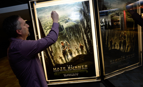 Francisco Kjolseth  |  The Salt Lake Tribune
Utah writer James Dashner, whose book, "The Maze Runner," is opening as a Hollywood blockbuster on Sept. 19, signs signs a poster as he stops by one of his regular spots, The District Movie Theatre near his home in South Jordan.