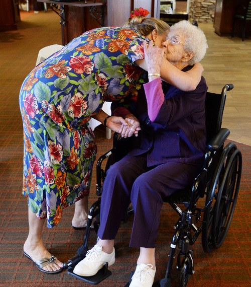 Steve Griffin  |  The Salt Lake Tribune


Lou Calder, a long-time resident at The Wellington Senior Living, gets a birthday hug from Karen Moore, the executive director of the senior living center in Salt Lake City Wednesday, September 17, 2014.  Calder was celebrating her 105th birthday during a Luau party at the center.  Calder was born in 1909 and grew up near Bear Lake, Utah, where she enjoyed golfing, sailing and raspberry milkshakes. Lou says longevity runs in her family and credits her long life to having a positive attitude and living a healthy lifestyle. She was also presented with birthday congratulation certificates from President Barack Obama and Governor Gary Herbert.
