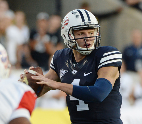 Steve Griffin  |  The Salt Lake Tribune


BYU Cougars quarterback Taysom Hill (4) looks for a receiver during game between BYU and Houston and LaVell Edwards Stadium in Provo, Thursday, September 11, 2014.