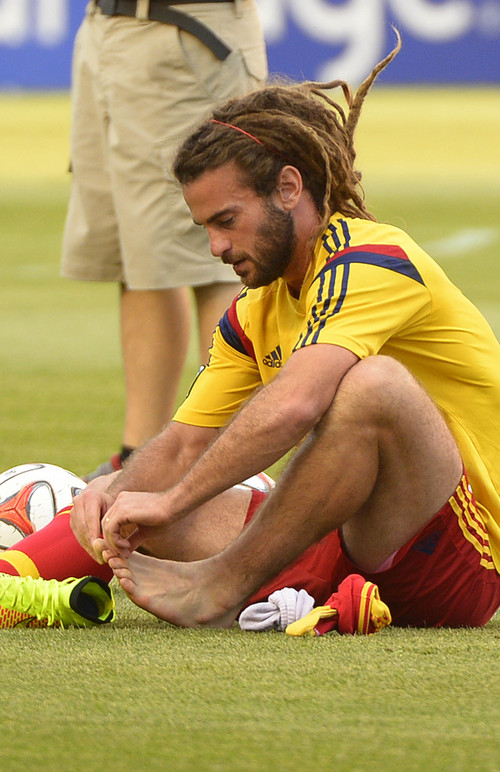 Leah Hogsten  |  The Salt Lake Tribune
Real Salt Lake midfielder Kyle Beckerman (5) tends to his troubled feet prior to the match up as Real Salt Lake leads D. C. United 3-0 Saturday, August 9, 2014, at Rio Tinto Stadium.