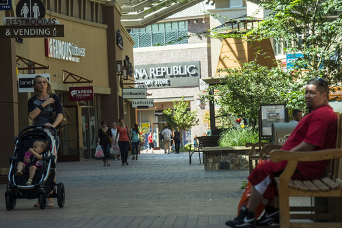 Chris Detrick  |  The Salt Lake Tribune
Shoppers walk around the Outlets at Traverse Mountain Wednesday September 17, 2014.