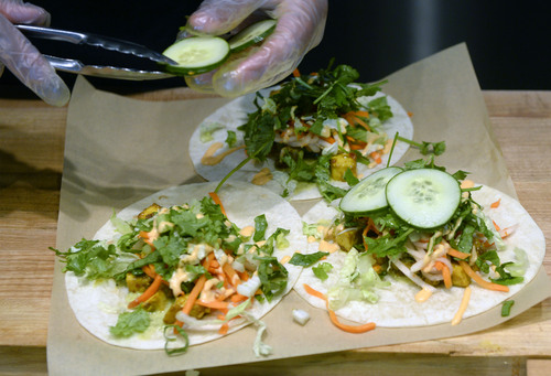 Al Hartmann  |  The Salt Lake Tribune
Zao Asian Cafe's tacos:  3 tortillas, choice of meat or tofu, romaine lettuce mix, chile-lime aioli, Korean red sauce and choice of vegetable toppings.