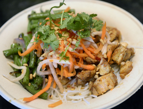 Al Hartmann  |  The Salt Lake Tribune
Zao Asian Cafe's rice noodle bowl made with chicken, seared vegetables, garnishes and choice of sweet soy, green curry or chile lemongrass sauce.