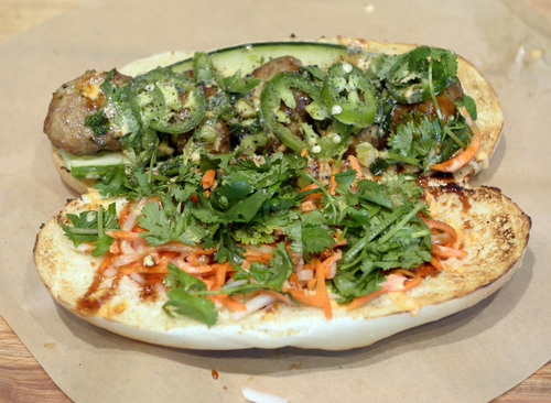 Al Hartmann  |  The Salt Lake Tribune
Zao Asian Cafe's banh mi sandwich with house-made chicken or pork meatballs comes with chile-lime aioli, house hoisin and choice of vegetables and toppings.  It's a lunch crowd favorite.