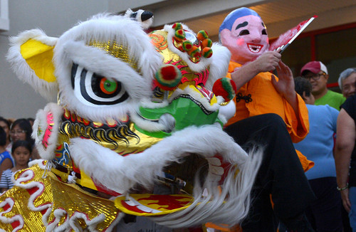 Leah Hogsten  |  The Salt Lake Tribune
The Lion and its warrior leader perform at Salt Lake City's Chinatown Market's inaugural Moon Festival that featured dancing, fireworks and martial art performances, September 5, 2014. The dance is meant to expel evil spirits and attract good luck for the coming year.