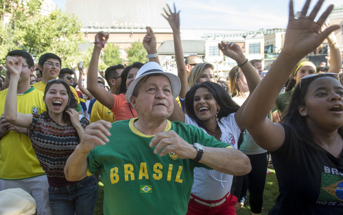 Rick Egan  |  The Salt Lake Tribune

The crowd dances to Brazilian music, at the10th Annual Utah Brazilian Festival at the Gateway, Saturday, September 13, 2014.  The festival features the best of Brazilian arts, culture, music and cuisine, along with face painting, capoeira.