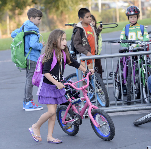 Al Hartmann  |  The Salt Lake Tribune
Students at Nibley Park Elementary in Salt Lake City ride their bikes to school Friday August 29.