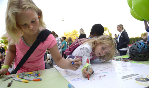 Al Hartmann  |  The Salt Lake Tribune
Students at Nibley Park Elementary in Salt Lake City sign a pledge to ride their bikes or walk to school Friday August 29.