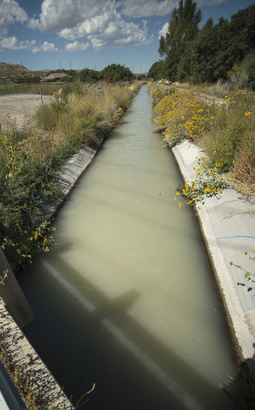Rick Egan  |  The Salt Lake Tribune

Water runs in the Welby water district canal in Bluffdale, Wednesday, September 17, 2014