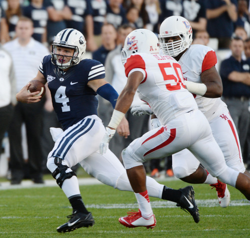 Steve Griffin  |  The Salt Lake Tribune


BYU Cougars quarterback Taysom Hill (4) runs around the end during game between BYU and Houston and LaVell Edwards Stadium in Provo, Thursday, September 11, 2014.