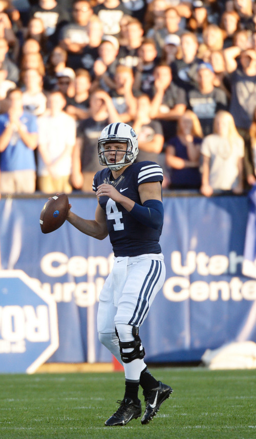 Steve Griffin  |  The Salt Lake Tribune


BYU Cougars quarterback Taysom Hill (4) looks for a receiver during game between BYU and Houston and LaVell Edwards Stadium in Provo, Thursday, September 11, 2014.