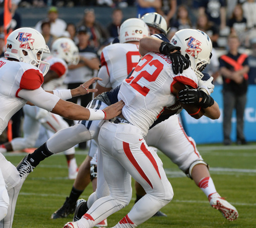 Steve Griffin  |  The Salt Lake Tribune


BYU Cougars linebacker Zac Stout (47) wraps up Houston Cougars running back Ryan Jackson (22) bringing him down for a safety during game between BYU and Houston and LaVell Edwards Stadium in Provo, Thursday, September 11, 2014.