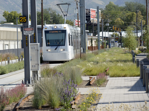 Al Hartmann  |  The Salt Lake Tribune
S-Line train passes by Utah's first ever multi-modal recreation corridor  September 19 near the 600 East South S-Line crossing. 
The S-Line Greenway is a mile-long green space from 500 East to McClelland Street that includes the S-Line streetcar, public plazas, art, walking paths, a bocce court and a new segment of Parley's Trail.