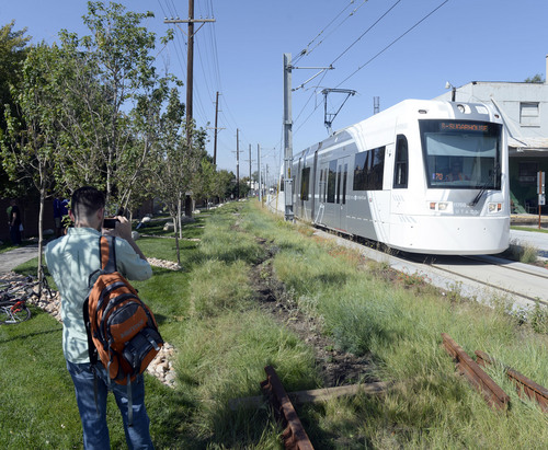 Al Hartmann  |  The Salt Lake Tribune
S-Line train passes by Utah's first ever multi-modal recreation corridor September 19 near the 600 East South S-Line crossing. 
The S-Line Greenway is a mile-long green space from 500 East to McClelland Street that includes the S-Line streetcar, public plazas, art, walking paths, a bocce court and a new segment of Parley's Trail.