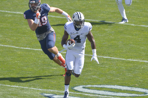 Chris Detrick  |  The Salt Lake Tribune
Brigham Young Cougars defensive back Robertson Daniel (4)runs the ball past Virginia Cavaliers tight end Zachary Swanson (49)  during the game at LaVell Edwards Stadium Saturday September 20, 2014.  Virginia is winning the game 16-13 at halftime.