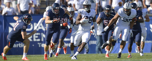 Chris Detrick  |  The Salt Lake Tribune
Brigham Young Cougars running back Adam Hine (28) runs for a 100-yard touchdown during the second half of the game at LaVell Edwards Stadium Saturday September 20, 2014.  BYU won the game 41-33.