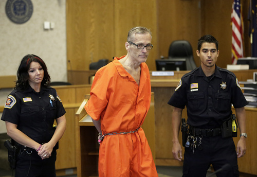 Martin MacNeill enters the courtroom before his sentencing Friday, Sept. 19, 2014, in Provo, Utah. MacNeill, a Utah doctor convicted of killing his wife in a trial that became a national true-crime cable TV obsession has been sentenced to 17 years to life in prison. MacNeill was found guilty of giving his wife drugs prescribed after cosmetic surgery and leaving her to drown in the bathtub of their home in 2007 so he could begin a new life with his mistress. (AP Photo/Rick Bowmer)