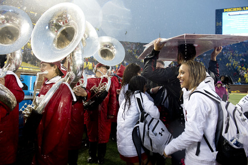 Jeremy Harmon  |  The Salt Lake Tribune

Utah band members and cheerleaders and the band wait to leave the stadium after the game was suspended due to bad weather as the Utes face the Wolverines in Ann Arbor, Saturday, Sept. 20, 2014.