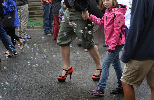 Scott Sommerdorf   |  The Salt Lake Tribune
Participants in the second annual "Walk a Mile in Her Shoes® Park City" walk up Main Street through soap bubbles, Sunday, September 21, 2014.