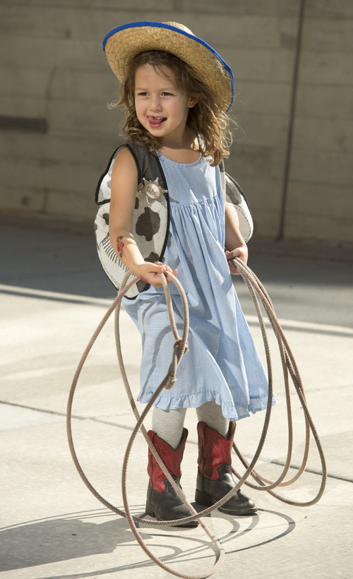 Rick Egan  |  The Salt Lake Tribune

Siena Slagle, 4, Salt Lake City, gets ready to rope a plastic bull, at the Natural History Museum of Utah during the Cowboy Festival and BBQ, Saturday, September 20, 2014.  As part of its special exhibit, The Horse, the Natural History Museum of Utah is hosting a Cowboy Festival and BBQ this weekend with Western-themed food and fun. The festival continues Sunday from 10 a.m. to 5 p.m, with a live barbecue, live music, cowboy poetry and hands-on activities for kids.