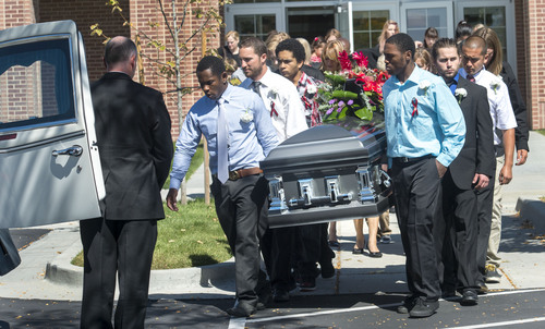 Steve Griffin  |  The Salt Lake Tribune

Family and friends serve as pallbearers as they carry the casket of Darrien Hunt following funeral services at the Saratoga Springs North Stake Center in Saratoga Springs, Utah Thursday, Sept. 18, 2014. Police officers in Saratoga Springs shot and killed Hunt on Sept. 10, 2014.