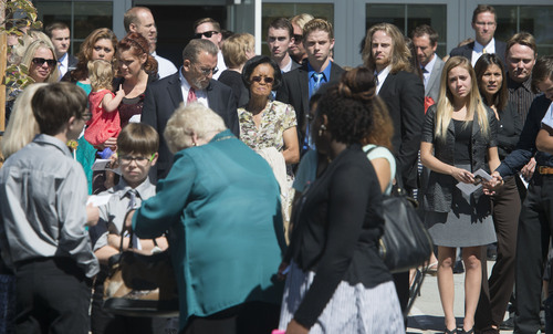 Steve Griffin  |  The Salt Lake Tribune

Family and friends watch as pallbearers carry the casket of Darrien Hunt following funeral services at the Saratoga Springs North Stake Center in Saratoga Springs, Utah Thursday, Sept. 18, 2014. Police officers in Saratoga Springs shot and killed Hunt on Sept. 10, 2014.