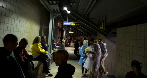 Jeremy Harmon  |  The Salt Lake Tribune

Fans wait out a rain delay as the Utes face the Wolverines in Ann Arbor, Saturday, Sept. 20, 2014.