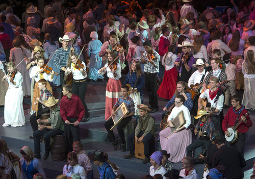 Rick Egan  |  The Salt Lake Tribune

Hundreds of LDS youth dressed as pioneers as they dance to the sounds of the fiddle, in the Dee Events Center for the Youth Cultural Celebration in anticipation tomorrow's Ogden Temple dedication, Saturday, September 20, 2014. Approximately 8000 LDS youth perform each of the celebrations on Saturday.