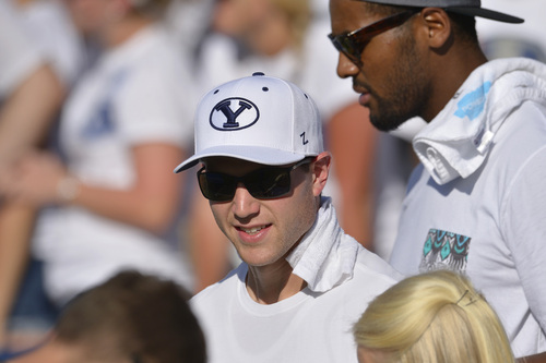Chris Detrick  |  The Salt Lake Tribune
Jimmer Fredette and Brandon Davies watch during the second half of the game at LaVell Edwards Stadium Saturday September 20, 2014.  BYU won the game 41-33.