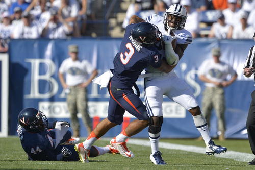 Chris Detrick  |  The Salt Lake Tribune
Virginia Cavaliers safety Quin Blanding (3) tackles Brigham Young Cougars running back Jamaal Williams (21) during the second half of the game at LaVell Edwards Stadium Saturday September 20, 2014.  BYU won the game 41-33.