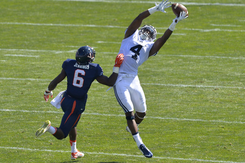 Chris Detrick  |  The Salt Lake Tribune
Brigham Young Cougars defensive back Robertson Daniel (4) nearly intercepts the ball intended for Virginia Cavaliers wide receiver Darius Jennings (6) during the game at LaVell Edwards Stadium Saturday September 20, 2014.  Virginia is winning the game 16-13 at halftime.