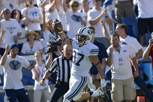 Chris Detrick  |  The Salt Lake Tribune
Brigham Young Cougars wide receiver Mitchell Juergens (87) celebrates his touchdown during the second half of the game at LaVell Edwards Stadium Saturday September 20, 2014.  BYU won the game 41-33.